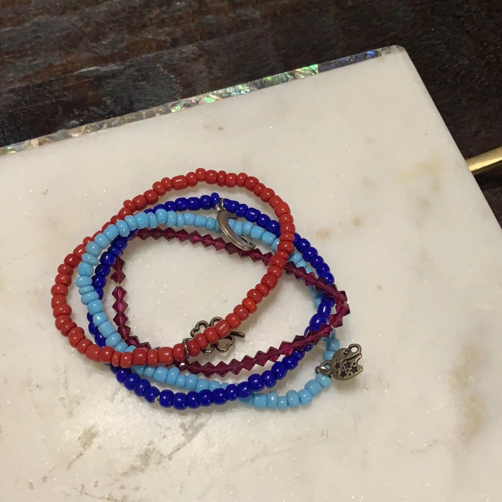 Four small charm bead stretchy bracelets